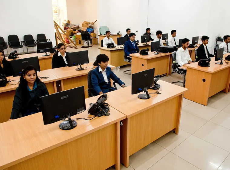 Members of the SiOnline team at their workstations