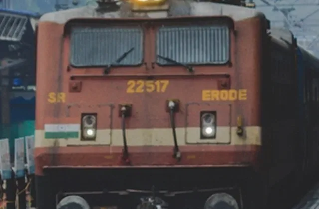A passenger train at an Indian railway platform